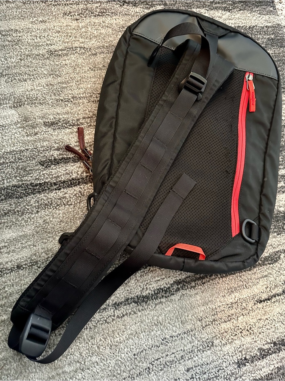 cotopaxi Black Sling Pack with Red Trim and Blue Accent - Picture 2 of 3